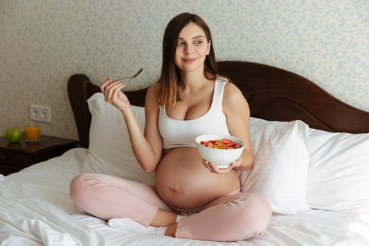 Pregnant woman eating nutritious foods